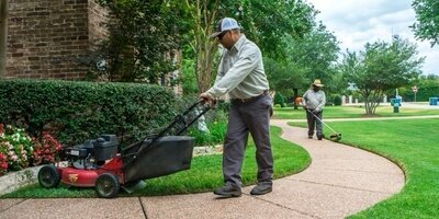 Cutting grass with lawn mower